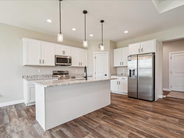 1326 Echo Ridge Ln, Marion, IA 52302 - kitchen featuring appliances with stainless steel finishes, white cabinets, dark wood finished floors, recessed lighting, and light stone countertops
