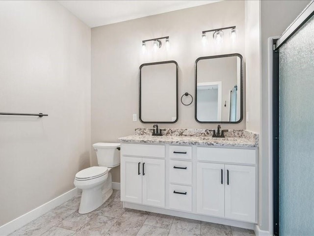 1326 Echo Ridge Ln, Marion, IA 52302 - bathroom featuring double vanity and a shower with door