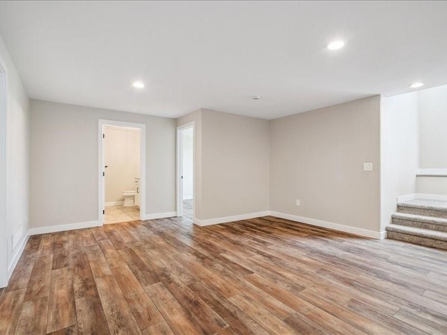 1326 Echo Ridge Ln, Marion, IA 52302 - unfurnished room featuring wood finished floors, stairway, and recessed lighting