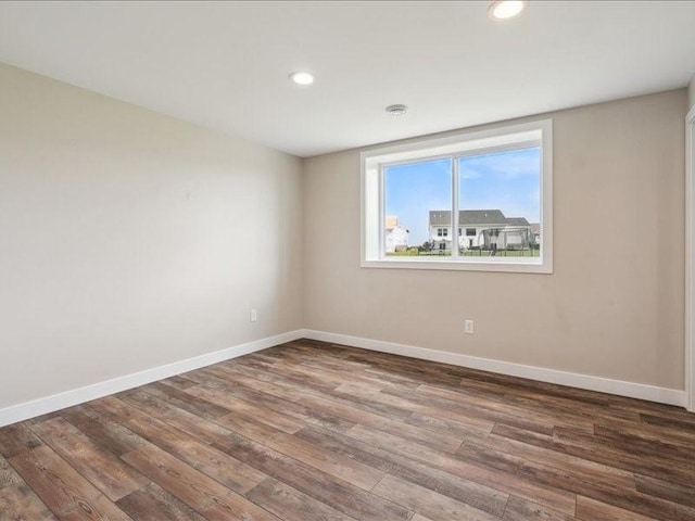 1326 Echo Ridge Ln, Marion, IA 52302 - unfurnished room with wood finished floors and recessed lighting