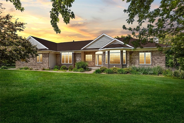 4452 Plumberry Rd, Ely, IA 52227 - ranch-style house with a lawn and brick siding