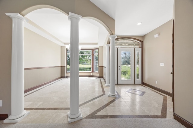 4452 Plumberry Rd, Ely, IA 52227 - entryway featuring inlaid floor details, decorative columns, recessed lighting, and arched walkways