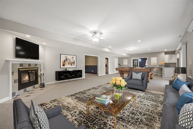 4452 Plumberry Rd, Ely, IA 52227 - living area with light carpet, a tile fireplace, recessed lighting, and a ceiling fan