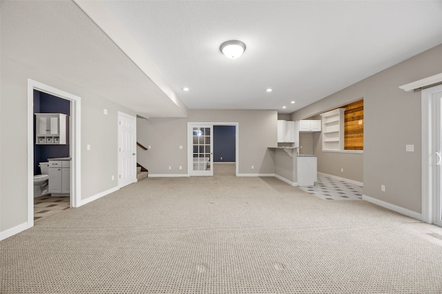 4452 Plumberry Rd, Ely, IA 52227 - unfurnished living room featuring light carpet, stairway, and recessed lighting