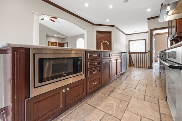 4452 Plumberry Rd, Ely, IA 52227 - kitchen featuring stone tile floors, appliances with stainless steel finishes, wall chimney exhaust hood, crown molding, and recessed lighting