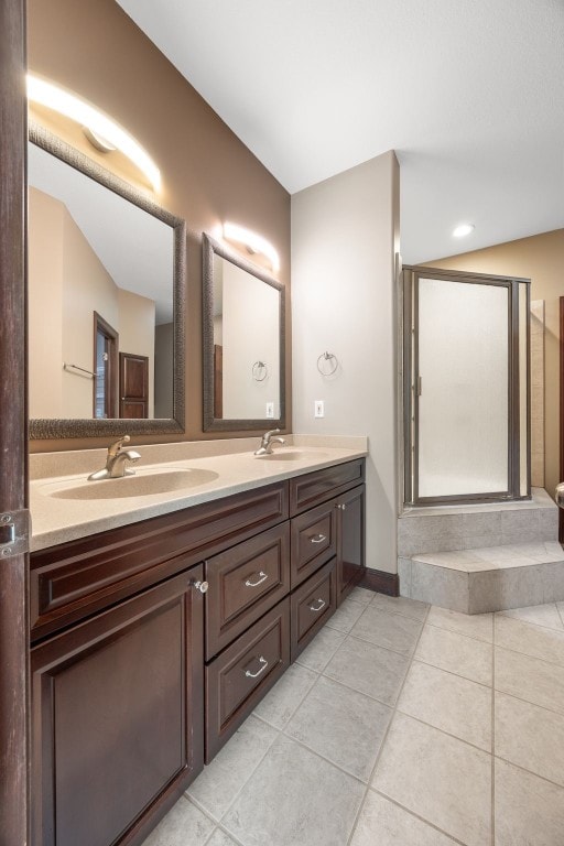 4452 Plumberry Rd, Ely, IA 52227 - full bathroom with double vanity and tile patterned floors