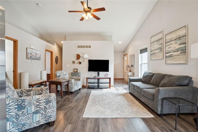 1727 Hunters Creek Way, Marion, IA 52302 - living room with vaulted ceiling, a ceiling fan, and dark wood-style flooring