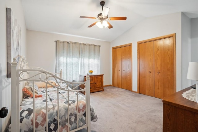 1727 Hunters Creek Way, Marion, IA 52302 - bedroom featuring light carpet, lofted ceiling, multiple closets, and a ceiling fan