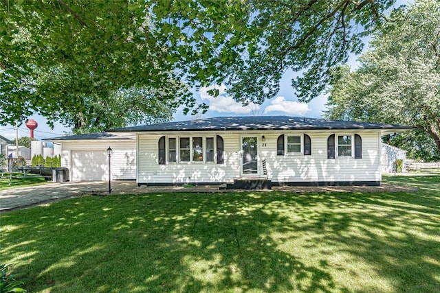 21 Mill St, Walker, IA 52352 - ranch-style home with an attached garage, a front yard, and concrete driveway