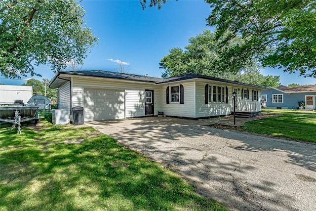 21 Mill St, Walker, IA 52352 - single story home with driveway, a garage, and a front yard
