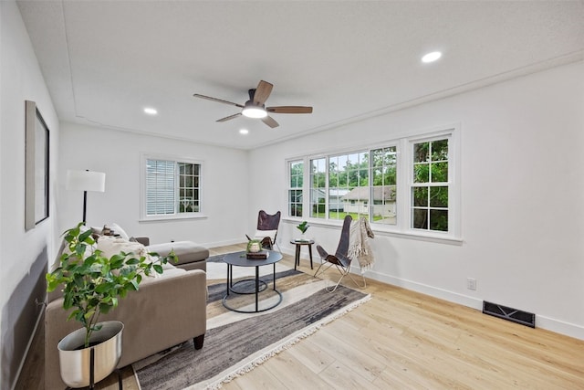 1642 19th St, Cedar Rapids, IA 52405 - living area with wood finished floors, ceiling fan, and recessed lighting