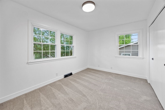 1642 19th St, Cedar Rapids, IA 52405 - carpeted empty room with baseboards