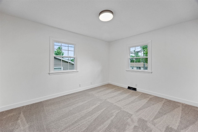 1642 19th St, Cedar Rapids, IA 52405 - spare room featuring carpet flooring and baseboards