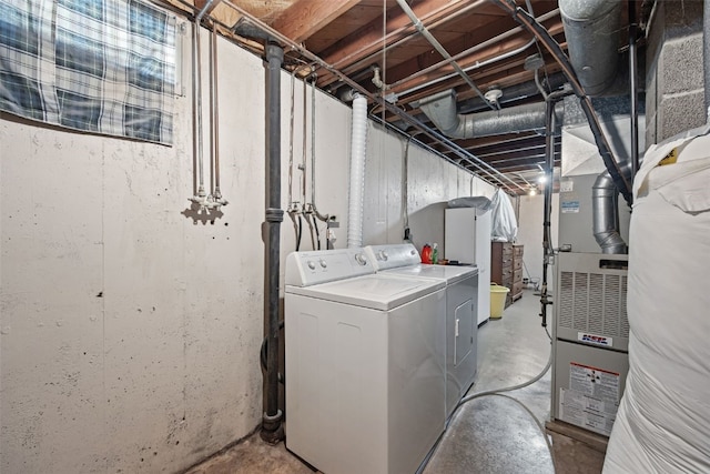 913 32nd St SE, Cedar Rapids, IA 52403 - laundry room featuring separate washer and dryer and heating unit