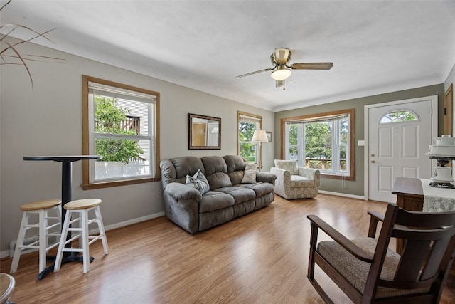 913 32nd St SE, Cedar Rapids, IA 52403 - living area featuring a ceiling fan and wood finished floors