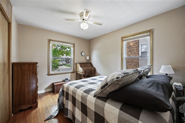913 32nd St SE, Cedar Rapids, IA 52403 - bedroom with light wood-type flooring and a ceiling fan