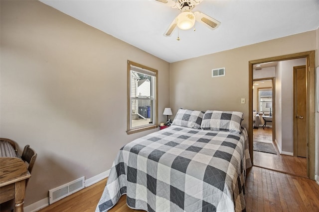 913 32nd St SE, Cedar Rapids, IA 52403 - bedroom featuring wood-type flooring and a ceiling fan