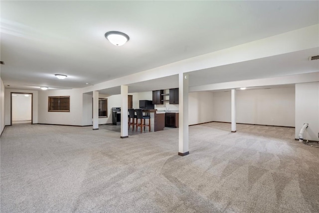6752 29th Ave, Shellsburg, IA 52332 - finished basement featuring light colored carpet and freestanding refrigerator