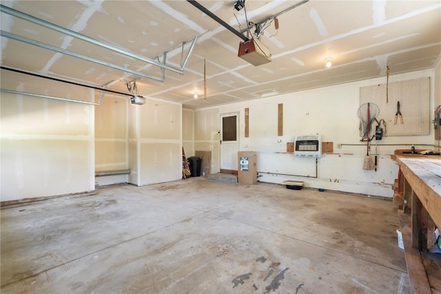 6752 29th Ave, Shellsburg, IA 52332 - garage featuring heating unit and a garage door opener