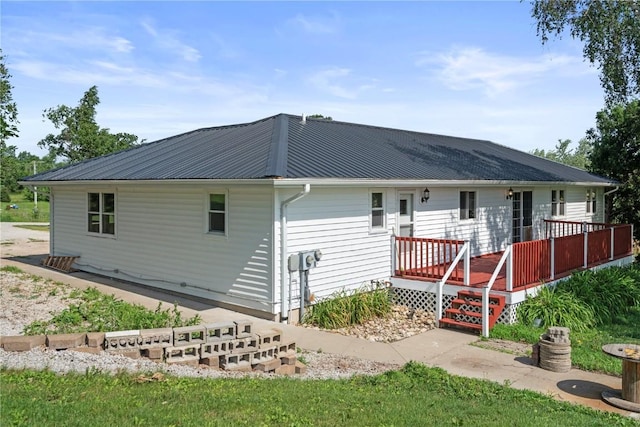 6752 29th Ave, Shellsburg, IA 52332 - rear view of property with a wooden deck and a metal roof