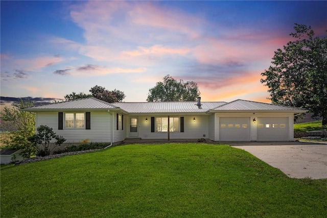 6752 29th Ave, Shellsburg, IA 52332 - single story home featuring a garage, concrete driveway, a yard, and a metal roof