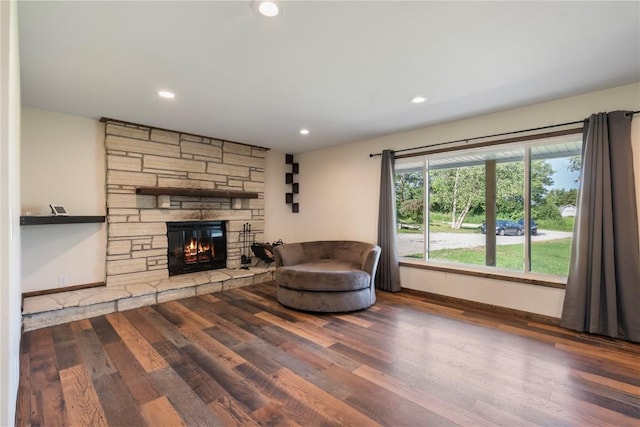 6752 29th Ave, Shellsburg, IA 52332 - living room with wood finished floors, a fireplace, and recessed lighting
