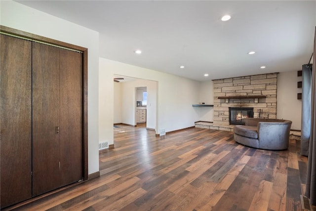 6752 29th Ave, Shellsburg, IA 52332 - living room with wood finished floors, a stone fireplace, and recessed lighting