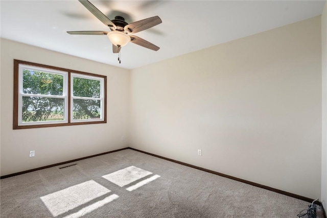 6752 29th Ave, Shellsburg, IA 52332 - unfurnished room with light colored carpet and a ceiling fan