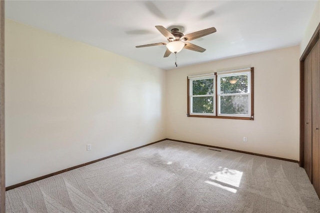 6752 29th Ave, Shellsburg, IA 52332 - unfurnished bedroom featuring carpet flooring, a closet, and ceiling fan