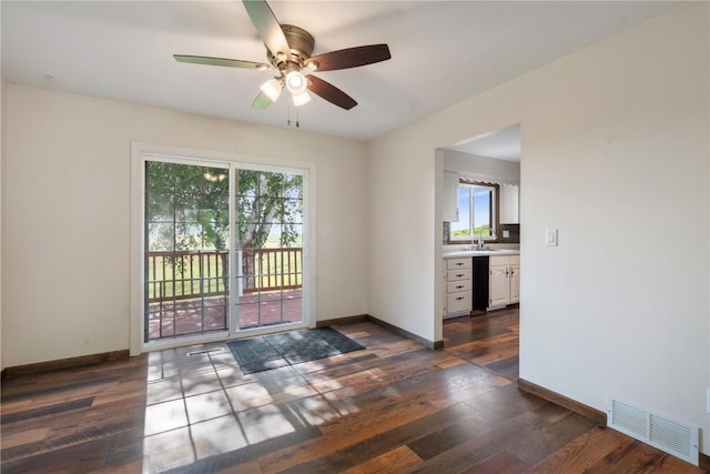 6752 29th Ave, Shellsburg, IA 52332 - spare room with ceiling fan and dark wood finished floors