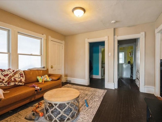 1551 C Ave NE, Cedar Rapids, IA 52402 - living area featuring baseboards and dark wood-style floors