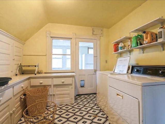1551 C Ave NE, Cedar Rapids, IA 52402 - laundry room with washer and clothes dryer and cabinet space