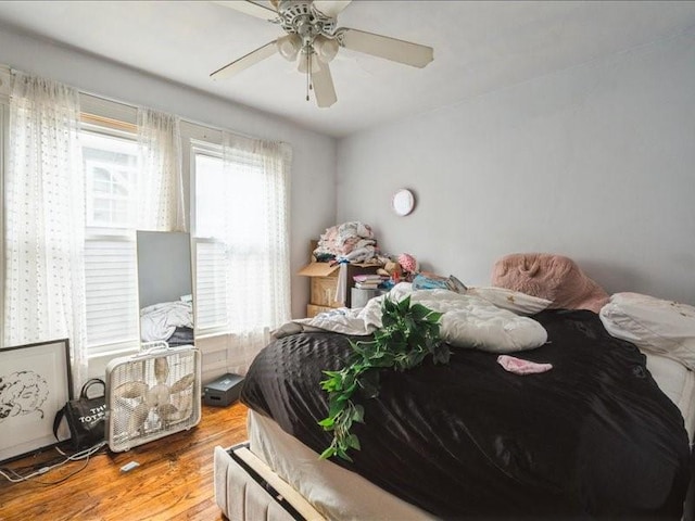 1551 C Ave NE, Cedar Rapids, IA 52402 - bedroom featuring wood finished floors and a ceiling fan