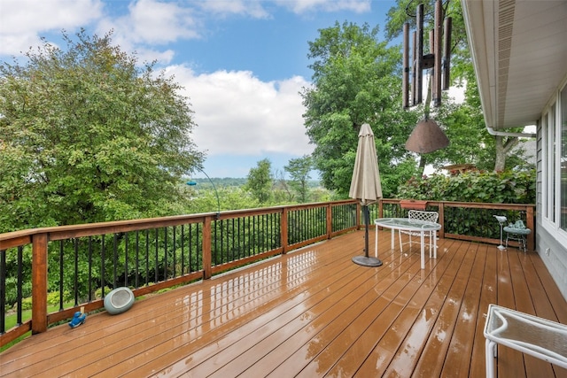 1661 Bilgarie Ct NE Unit A, Cedar Rapids, IA 52402 - wooden terrace featuring outdoor dining space