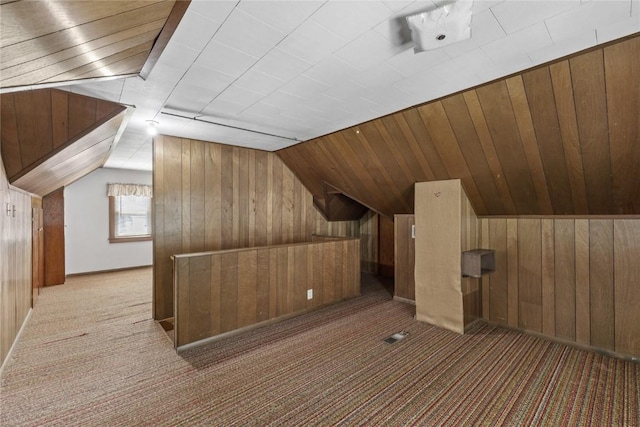 340 18th St NW, Cedar Rapids, IA 52405 - bonus room featuring wooden walls, carpet floors, and vaulted ceiling