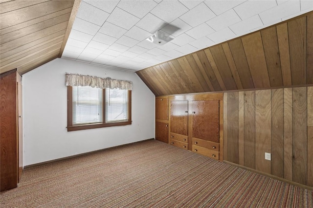 340 18th St NW, Cedar Rapids, IA 52405 - bonus room with carpet, lofted ceiling, and wooden walls