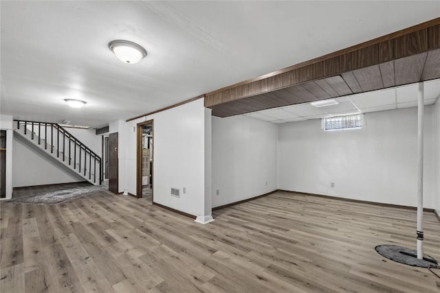 340 18th St NW, Cedar Rapids, IA 52405 - below grade area featuring wood finished floors and stairway