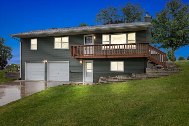 7812 Wieneke Cir, Cedar Rapids, IA 52404 - view of front of property featuring a chimney, driveway, a front lawn, a garage, and a wooden deck