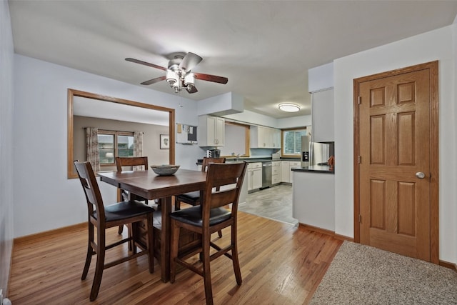 7812 Wieneke Cir, Cedar Rapids, IA 52404 - dining area featuring light wood-style flooring, healthy amount of natural light, and a ceiling fan