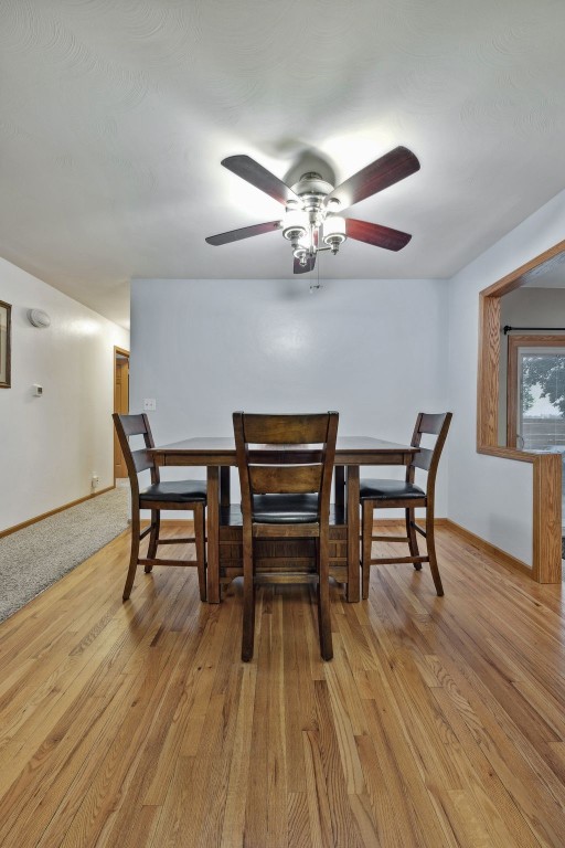 7812 Wieneke Cir, Cedar Rapids, IA 52404 - dining area featuring light wood finished floors and ceiling fan