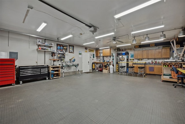 7812 Wieneke Cir, Cedar Rapids, IA 52404 - garage featuring a workshop area and a garage door opener