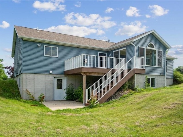 3182 62nd St, Shellsburg, IA 52332 - back of property with a patio, a wooden deck, and a yard