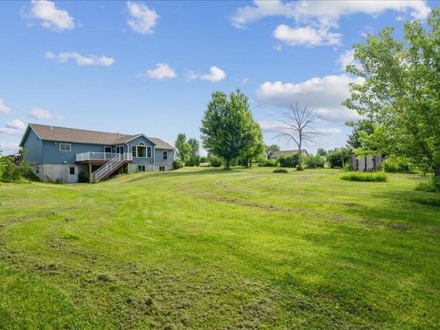 3182 62nd St, Shellsburg, IA 52332 - view of green lawn featuring a deck and stairs