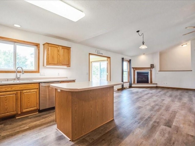 3182 62nd St, Shellsburg, IA 52332 - kitchen with stainless steel dishwasher, light countertops, dark wood-type flooring, a kitchen island, and open floor plan
