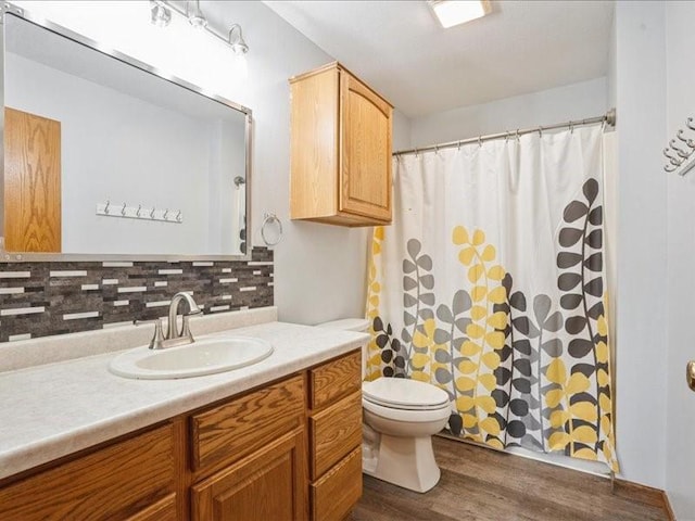 3182 62nd St, Shellsburg, IA 52332 - bathroom with backsplash, vanity, wood finished floors, and curtained shower