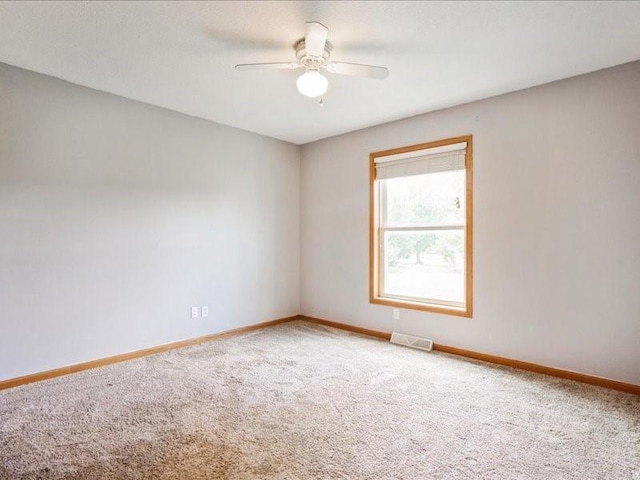 3182 62nd St, Shellsburg, IA 52332 - spare room with carpet and a ceiling fan