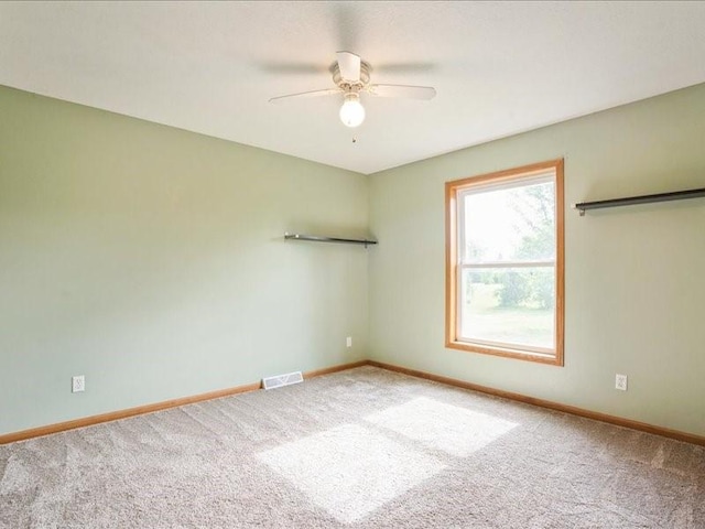 3182 62nd St, Shellsburg, IA 52332 - empty room with carpet floors and ceiling fan