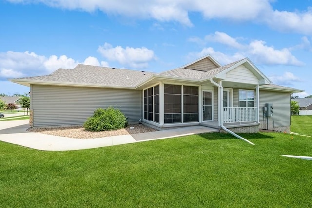 919 Deer Run Dr NE, Cedar Rapids, IA 52402 - rear view of house featuring a yard, a sunroom, and roof with shingles