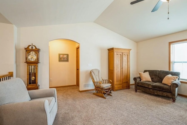 919 Deer Run Dr NE, Cedar Rapids, IA 52402 - living room featuring arched walkways, vaulted ceiling, light colored carpet, and ceiling fan