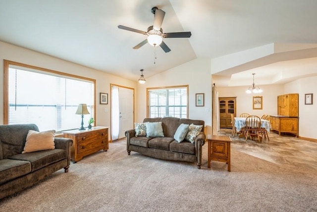 919 Deer Run Dr NE, Cedar Rapids, IA 52402 - living area with light carpet, a chandelier, a ceiling fan, and vaulted ceiling
